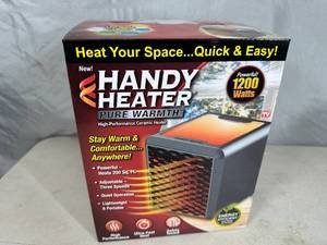 lot 240 image: New Handy Heater Pure Warmth Ceramic Space Heater with LED Lights
