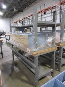 lot 628 image: METAL, ADJUSTABLE HEIGHT, U-LINE PACKING TABLES AND WOODEN HUTCH