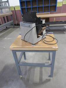 lot 619 image: ROLLING METAL TABLE WITH PAPER JOGGER