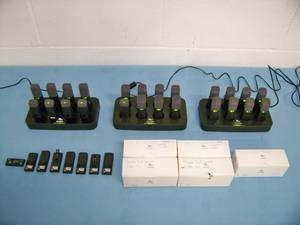 lot 119 image: (24) Revolabs Wireless Lapel Mics  Microphones with (3) Charging Bases and (5) Replacement Mics that are NEW IN BOX