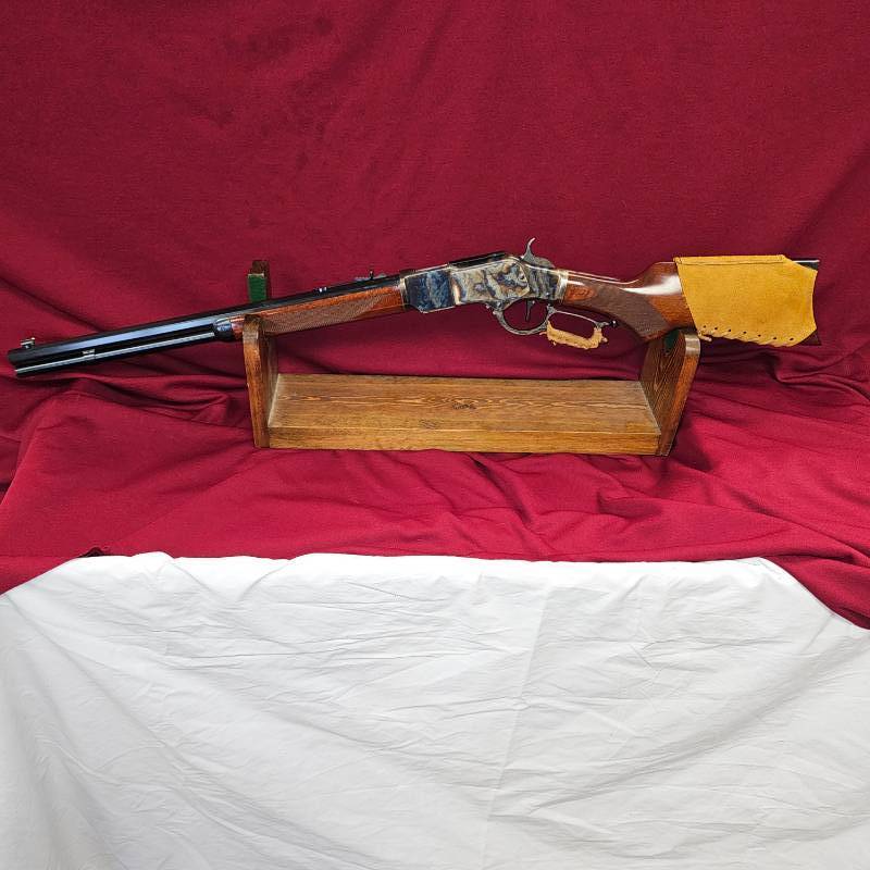 lot 7 image: Taylors and Company Cowboy 1873 Winchester RACE Gun, .357 Magnum, Pioneer Action Job Stage 3 Octagon Barrel Rifle, Case Hardening and Leather Attributes