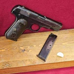lot 39 image: Colt 1908 Pocket Hammerless, 32 ACP, Retaining 90% Original Finish and Grips. Type II 1908-1910 Build Date-with 2 Magazines