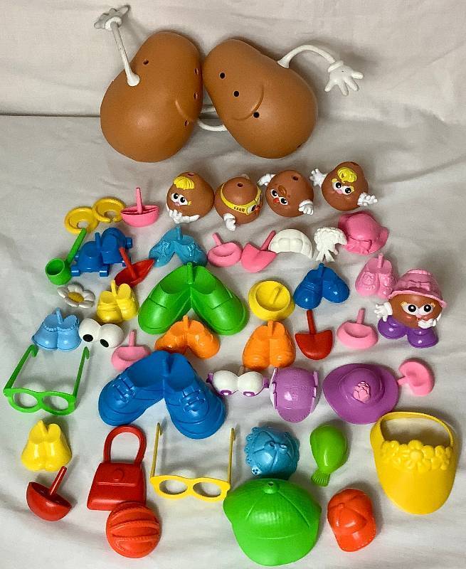 lot 57 image: Playskool Mr. and Mrs. Potato Head & Family with Many Accessories