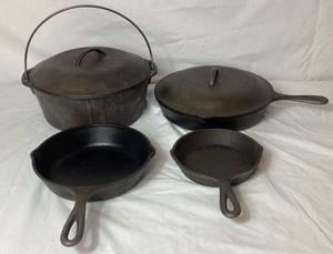 lot 31 image: Cast Iron Collection - 3 Lodge Skillets with lid and No 8 Dutch Oven with Lid