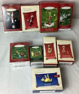 lot 69 image: Assortment of Dr. Seuss Hallmark Ornaments from Cat in the Hat, How the Grinch Stole Christmas, and Dr. Seuss Books