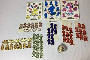 lot 74 image: Large Lot of Vintage Moodie Sticker Sets, Happy, Sad & Sexy plus Vintage Stick On Moodie PatchesAppliques