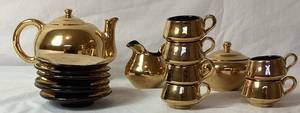lot 75 image: Bram MCM Gold Lustre Tea Set - 6 saucers & cups, Teapot, Cream & Sugar Dishes