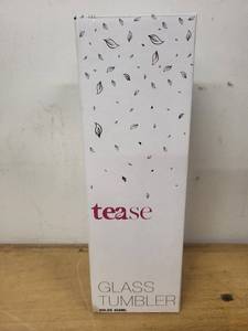 lot 64 image: Tease Glass Tumbler with Infuser, Sleeve, Teapot, and Glass Candle Holder Set