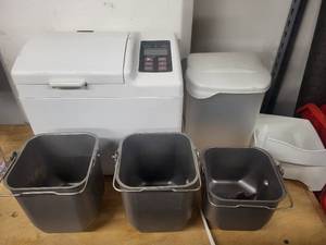 lot 66 image: Oster Bread Maker with 3 Pans and Ingredient Container