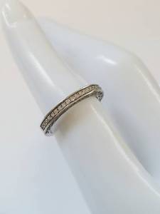 lot 31Q image: Elegant Eternity Ring with Clean Stones
