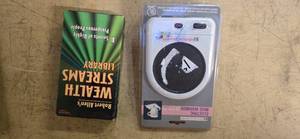 lot 26 image: Lot of a VCD -WealthStreams (USED) and an Electric Tea Cup (New)