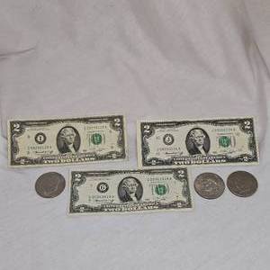 lot 15 image: 3-1976 $2 Billes and 3 Ike Silver Dollars 1974,76,77