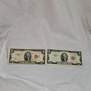 lot 28 image: 2-1953 $2 Red Seal Notes, One is a Star Note