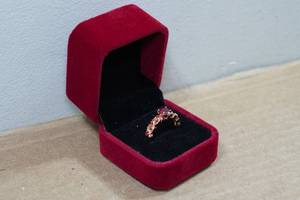 lot 206 image: Rose Gold Tone Ring with Red Stones - Size 9.5