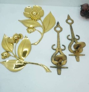lot 59 image: Metal & Poly Wall Art. Gold Toned Flowers & Wall Sconces