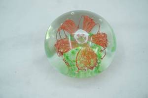lot 68 image: Vintage Art Glass Paperweight Featuring A red Flower and Green Round Base Design