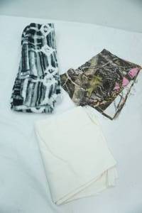 lot 97 image: Flour Sack Dish Towel, Camo Fabric Squares, Fleece Scarf