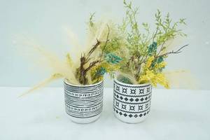 lot 100 image: Southwestern-Inspired White Stoneware Planters wblack designs
