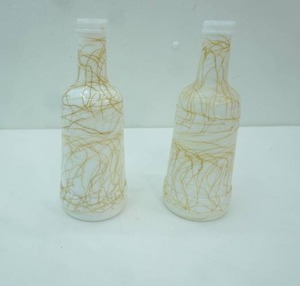 lot 268 image: Vintage Hazel-Atlas Milk Glass Bottles wgold drizzle pattern