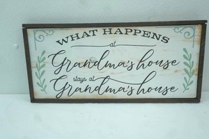 lot 288 image: What Happens at Grandmas House Wooden Wall Decor 22x10