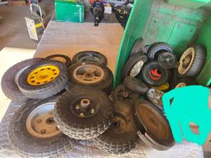 lot 26 image: Lot of Lawn Mower Wheels and Tires Assortment including Various Sizes and Types