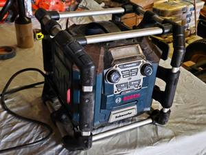 lot 135 image: Bosch PowerBox Jobsite Radio with Subwoofer features Bluetooth connectivity, multiple power outlets, and a built-in subwoofer