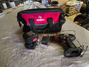 lot 181 image: Husky Tool Bag with Skil 9.6V Cordless Drill, Charger, and Battery