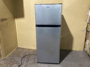 lot 104 image: Galanz 24 in. 10 cu. ft. Top Freezer Refrigerator, Stainless Steel look, Frost Free, Energy Star