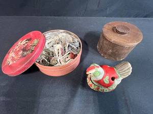 lot 23 image: Vintage Sewing Notions Collection with Metal Buckles, Buttons, and Decorative Chicken Pin Cushion