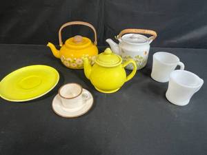 lot 29 image: Vintage Tea Set with 3 Teapots, 2 Mugs, Saucers (one Tracy Porter for ZRIKE), and Cup