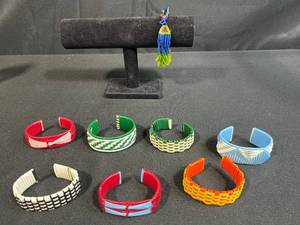 lot 159 image: Collection of Woven Plastic Cuff Bracelets and 1 Beaded Bracelet