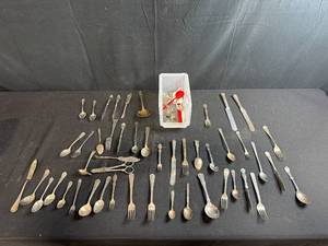 lot 192 image: Large Lot of Assorted Vintage Flatware Including Spoons, Forks, and Knives