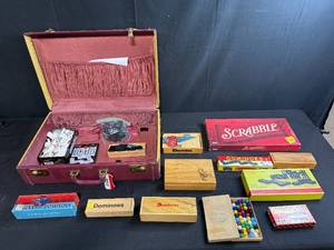 lot 213 image: Vintage Game Collection with Domino Sets, Scrabble, and Chinese Checkers Marbles in Suitcase