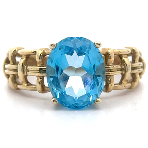 lot 11 image: Oval Natural Blue Topaz Openwork Basketweave Ring in Yellow Gold VIDEO