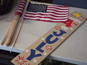 lot 487 image: Lot of (10) U.S.A. Flag on Wood Stick and 4th of July Wooden Hanging Sign 7x35