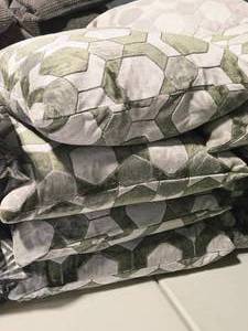 lot 319 image: Lot of (4) 21 Covered Throw Pillow - Manipur by Designers Guild with Cut Velvet Hexagonal Geometric pattern (assorted grey)