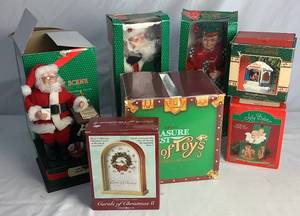 lot 58 image: Holiday Musical and Figurine Bundle with 14 Plush Santa and Mrs. Claus and Howard Miller Carols of Christmas II Clock