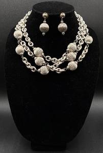 lot 93 image: Givenchy 17 Silver Tone Ball Necklace and Earrings (Unmarked)