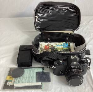 lot 90 image: Nikon EM SLR 35mm Camera with 50mm Nikon Series E Lens and Flash