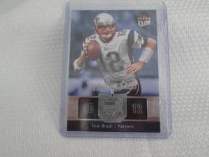 lot 95 image: 2007 Ultra Tom Brady Ultra Star Car...