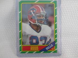 lot 428 image: 1986 Topps Andre Reed Rookie Card...