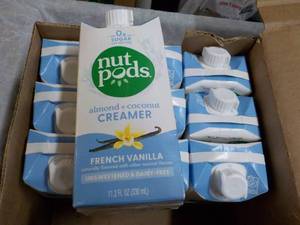 lot 54 image: Case of 10 Nut Pods 12 oz Almond an...