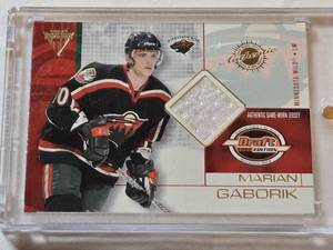 lot 20 image: Marian Gaborik Rookie Relic 2002 Pacific Titanium Draft Edition Authentic Game-Worn Jersey #45 - Minnesota Wild Hockey Card