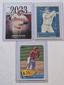 lot 42 image: Lot of 3 Shohei Ohtani Baseball Cards Including 2023 Topps Greatest Hits, Blueprint, and Angels Designated Hitter Cards