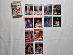 lot 48 image: Lot of 12 NBA Hoops Collect A Books Featuring Larry Bird, Scottie Pippen, and Akeem Olajuwon