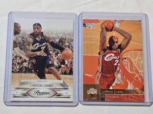 lot 110 image: Lot of 2 LeBron James Basketball Cards Featuring 2009 Panini Prestige and Upper Deck.