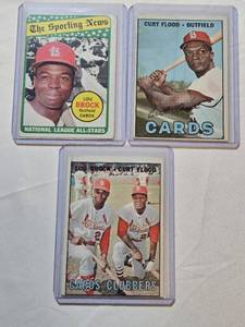 lot 122 image: Lot of 3 Baseball Cards Featuring Lou Brock and Curt Flood - Includes The Sporting News and Cards Clubbers Series