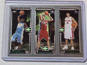 lot 135 image: 2003-04 Topps Rookie Matrix basketball trading card featuring LeBron James, Carmelo Anthony, and either Darko Milicic or Chris Kaman