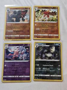 lot 228 image: Lot of 4 Holo Pokemon Cards Featuring Decidueye, Pangoro, Coalossal, and Zoroark