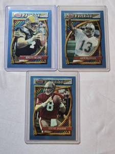 lot 232 image: Lot of 3 Topps Finest Football Cards Featuring Dan Marino, Steve Young, and Brett Favre.